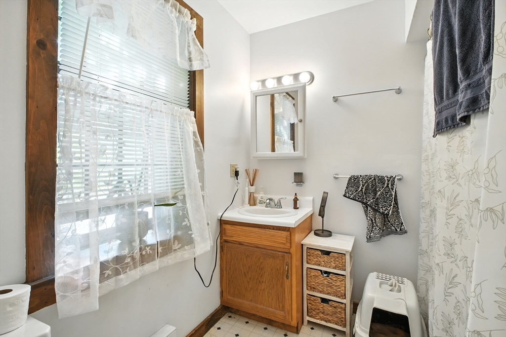167 Warren Wright Road Belchertown, MA 01007 - Photo 28 of 42 a bathroom with a sink a toilet and shower