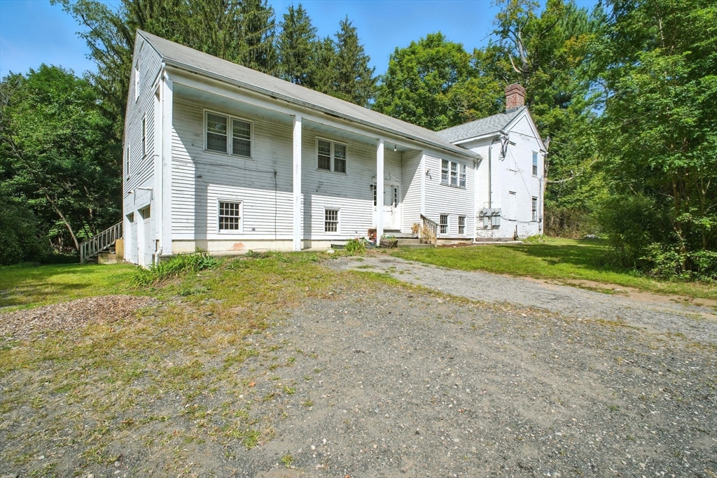 167 Warren Wright Road Belchertown, MA 01007 - Photo 3 of 42 a view of a house with a yard