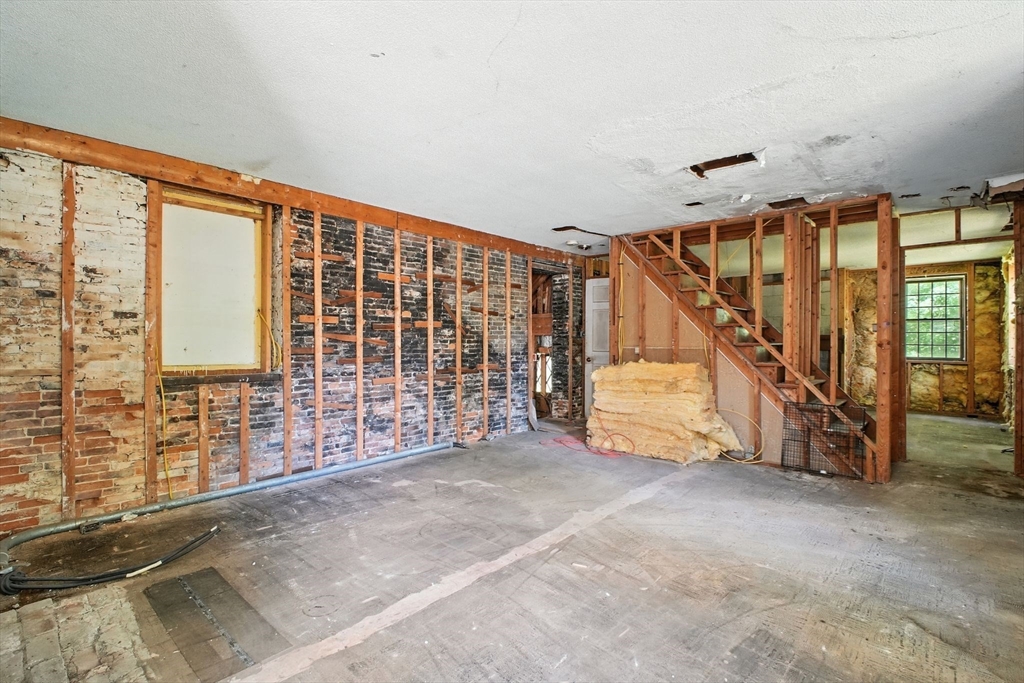 167 Warren Wright Road Belchertown, MA 01007 - Photo 35 of 42 a view of an empty room with stairs