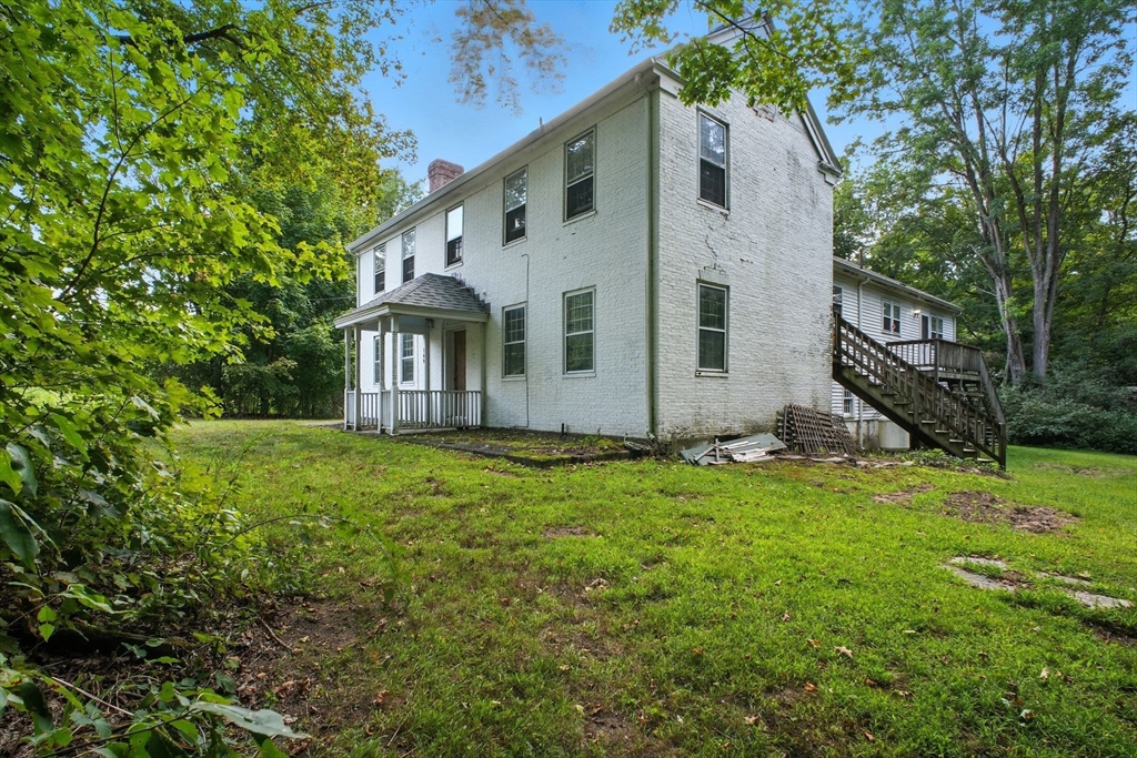 167 Warren Wright Road Belchertown, MA 01007 - Photo 4 of 42 a view of a back yard of the house