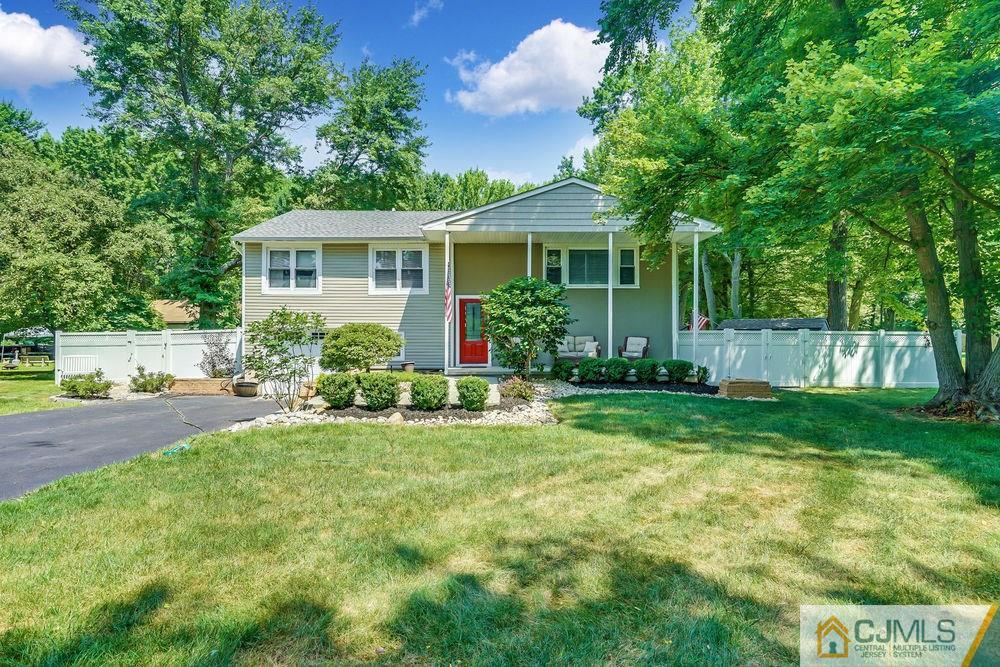 334 Matchaponix Road Old Bridge, NJ 08831 - Photo 2 of 24 a front view of a house with a yard and porch