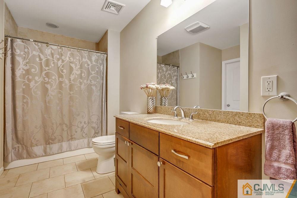 334 Matchaponix Road Old Bridge, NJ 08831 - Photo 12 of 24 a bathroom with a granite countertop sink toilet and shower