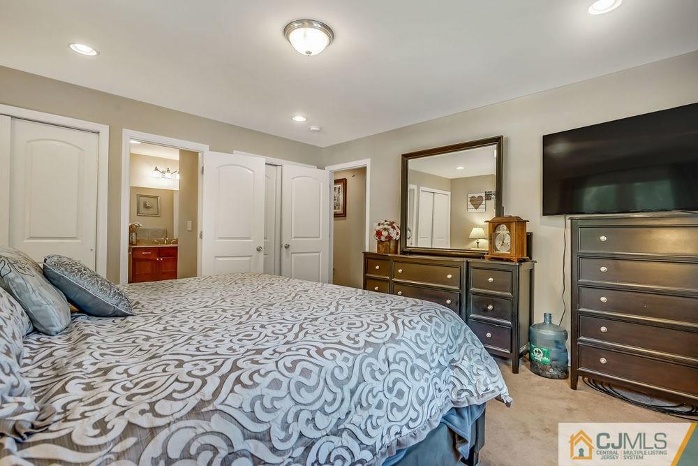 334 Matchaponix Road Old Bridge, NJ 08831 - Photo 16 of 24 a bed room with a bed and a television