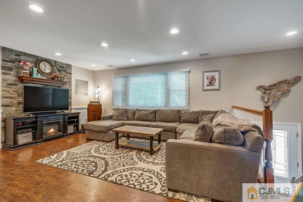 334 Matchaponix Road Old Bridge, NJ 08831 - Photo 3 of 24 a living room with furniture and a flat screen tv