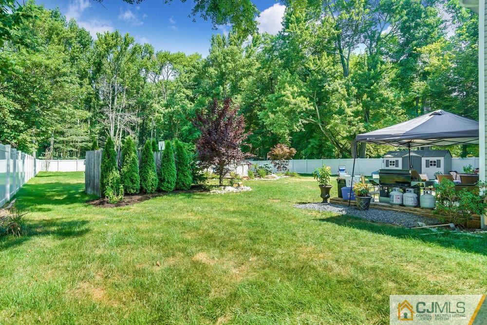 334 Matchaponix Road Old Bridge, NJ 08831 - Photo 24 of 24 a view of a house with backyard sitting area and garden