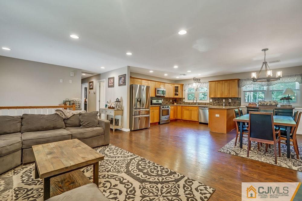 334 Matchaponix Road Old Bridge, NJ 08831 - Photo 6 of 24 a living room with furniture and kitchen view