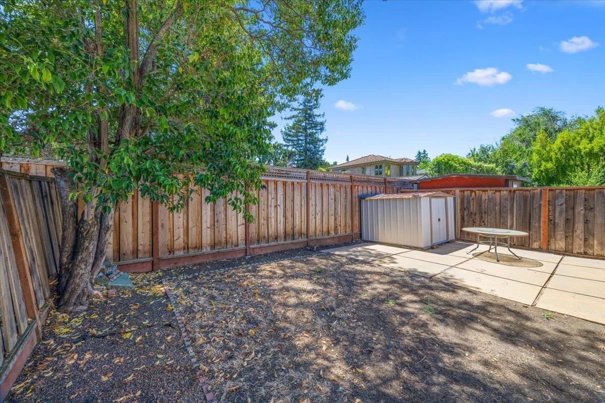 440 Rutherford Avenue Redwood City, CA 94061 - Photo 19 of 19 a view of backyard with wooden fence and trees