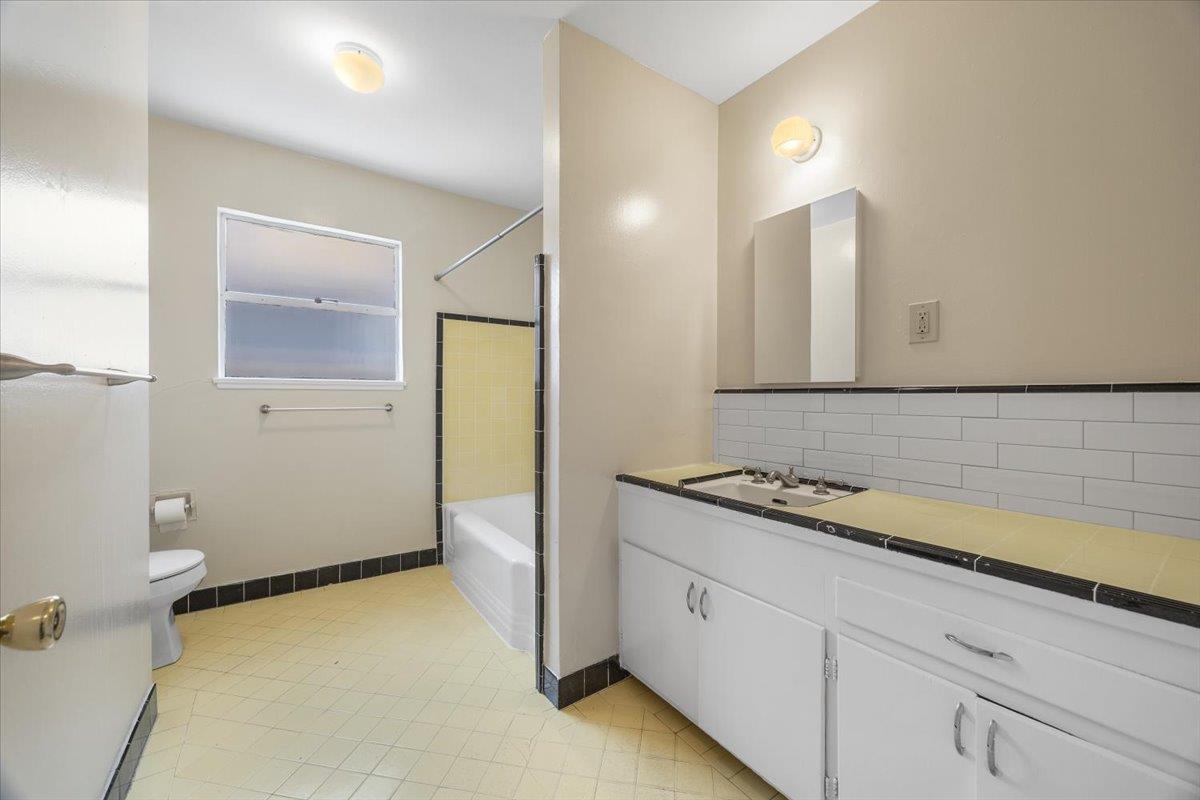 440 Rutherford Avenue Redwood City, CA 94061 - Photo 10 of 19 a bathroom with a sink and a mirror