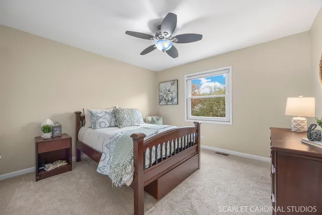 a bedroom with a bed and window