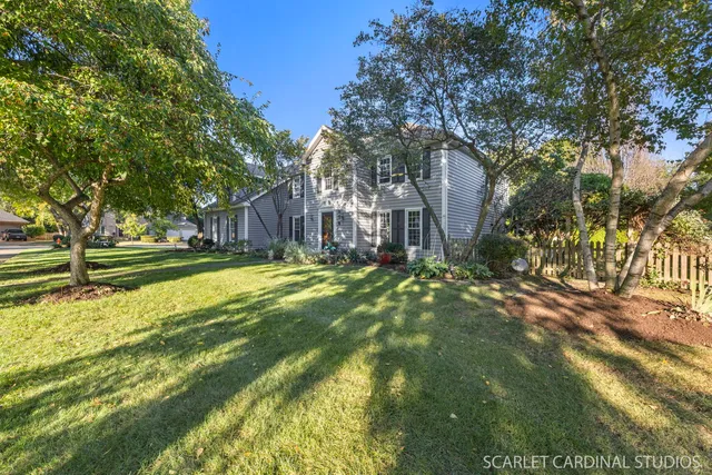 a view of yard with swimming pool and trees