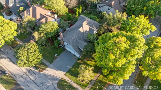 an aerial view of house with yard