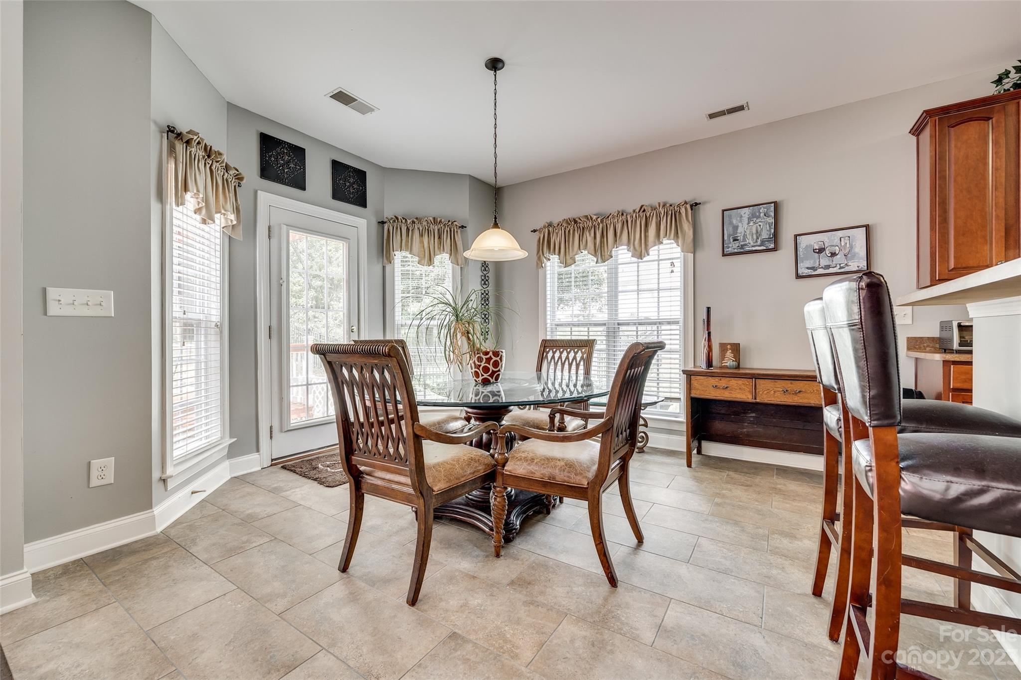 5540 Alexandrite Way Fort Mill, SC 29708 - Photo 12 of 46 a dining room with furniture and window