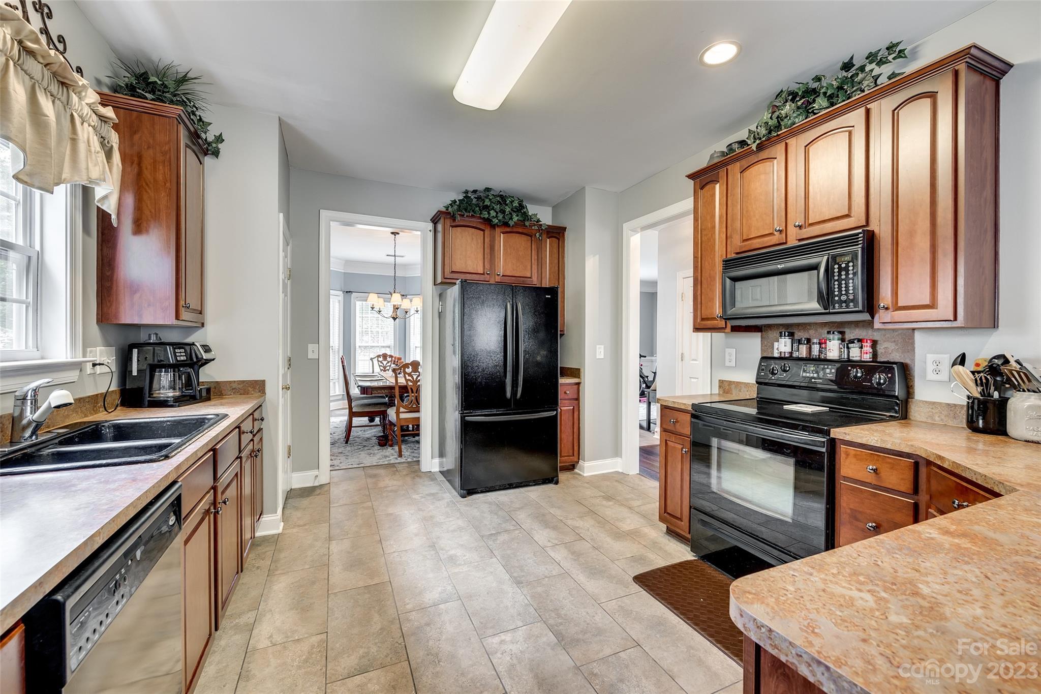 5540 Alexandrite Way Fort Mill, SC 29708 - Photo 14 of 46 a kitchen with a sink stove and refrigerator
