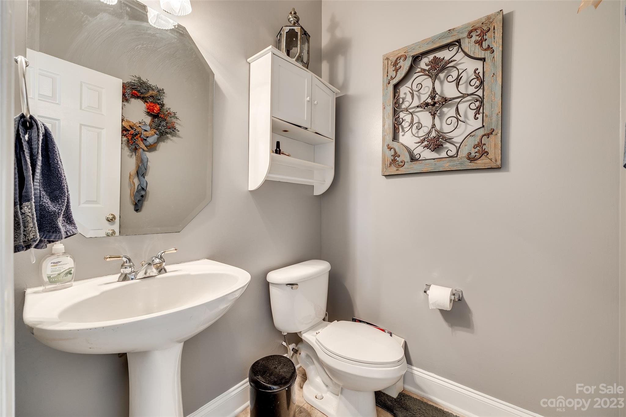 5540 Alexandrite Way Fort Mill, SC 29708 - Photo 17 of 46 a bathroom with a toilet a sink and a mirror