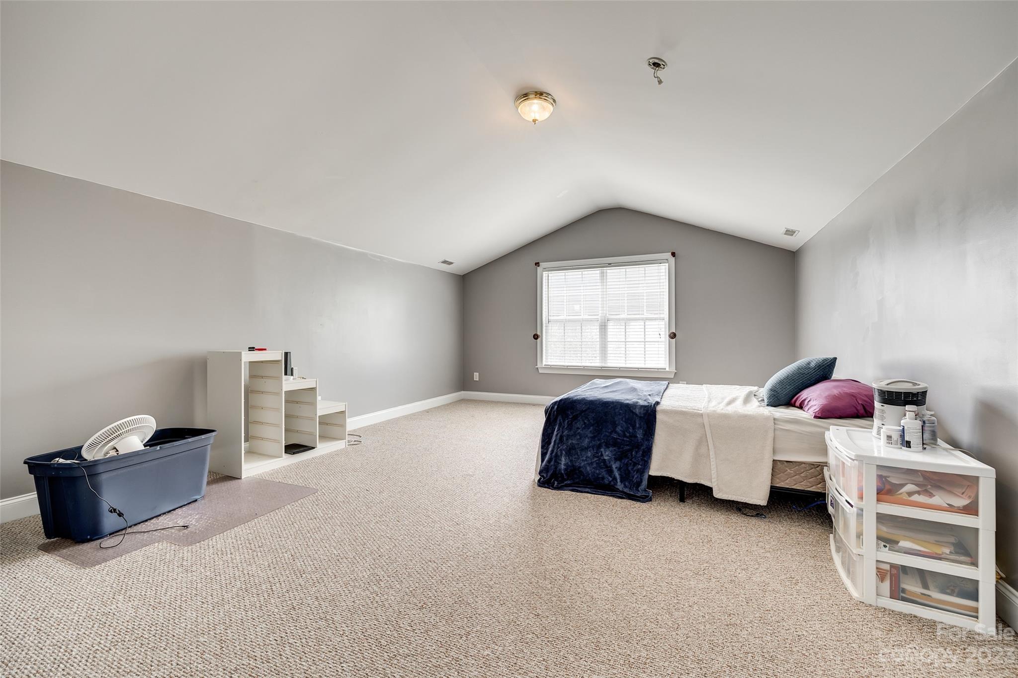 5540 Alexandrite Way Fort Mill, SC 29708 - Photo 26 of 46 a spacious bedroom with a bed and a window