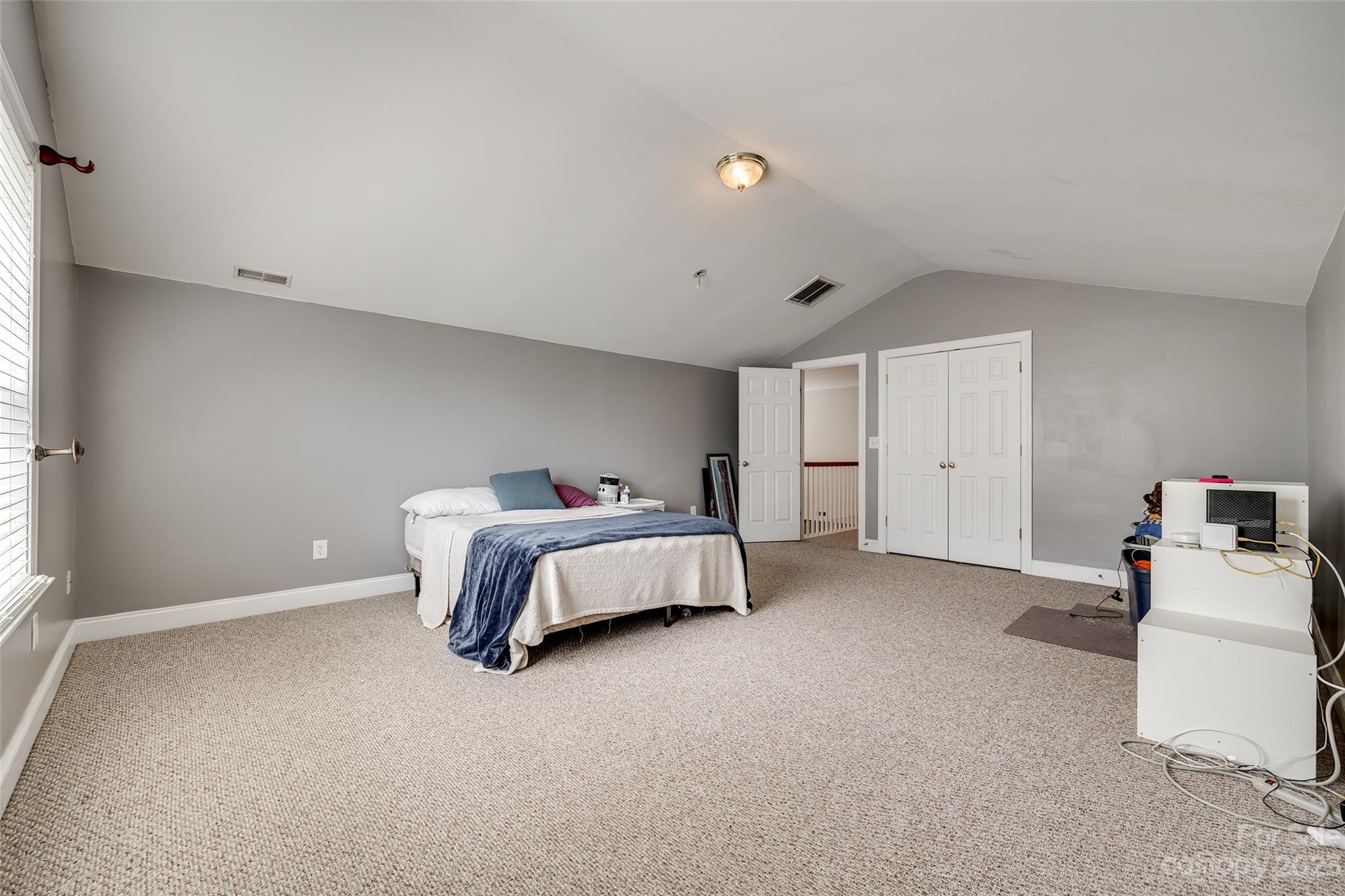 5540 Alexandrite Way Fort Mill, SC 29708 - Photo 27 of 46 a bedroom with a bed and dresser