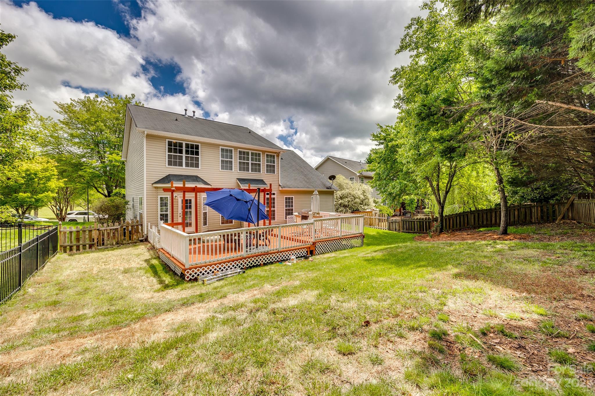 5540 Alexandrite Way Fort Mill, SC 29708 - Photo 38 of 46 a view of a house with a big yard and large trees