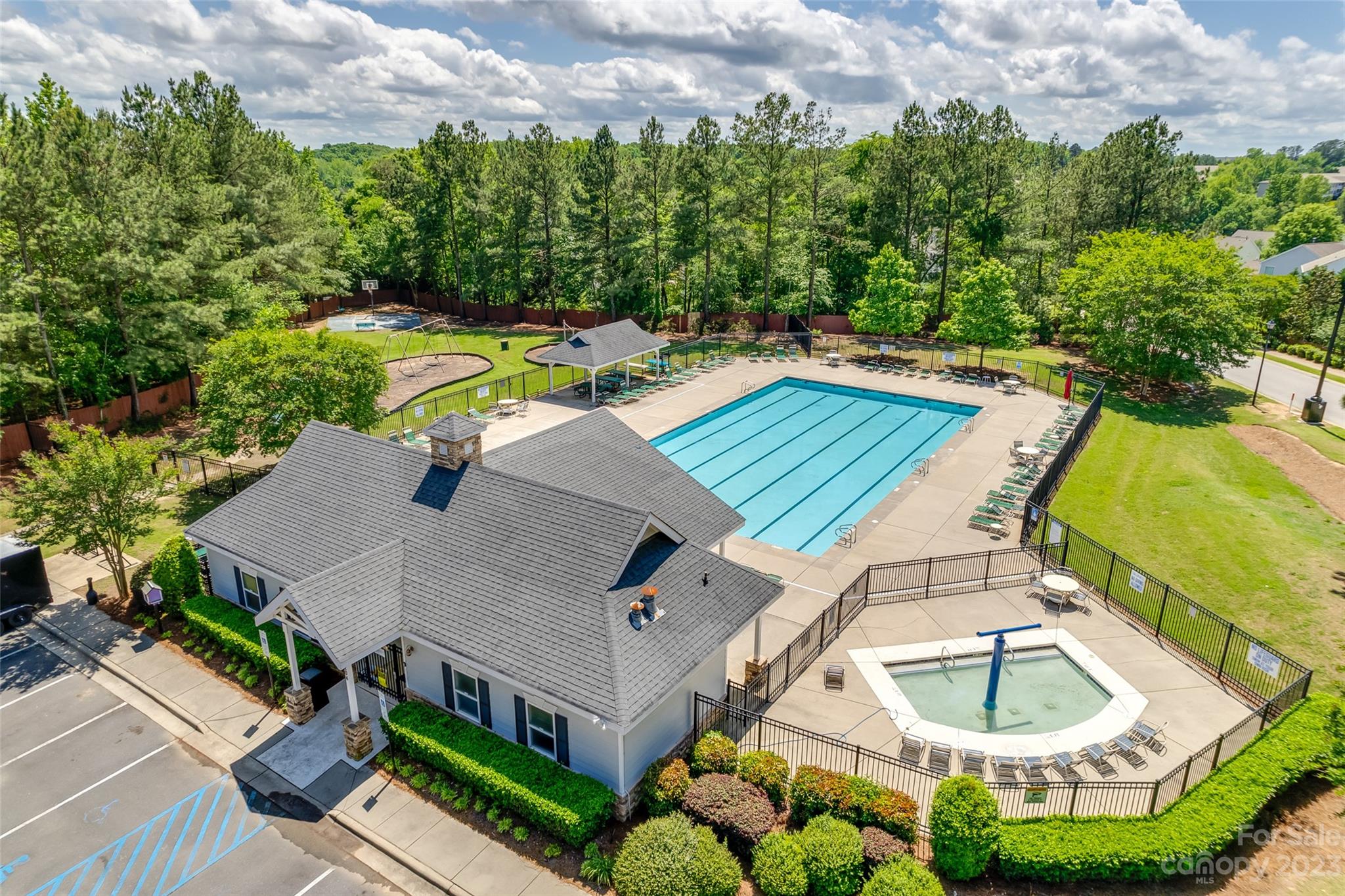5540 Alexandrite Way Fort Mill, SC 29708 - Photo 42 of 46 an aerial view of a house with a swimming pool and garden