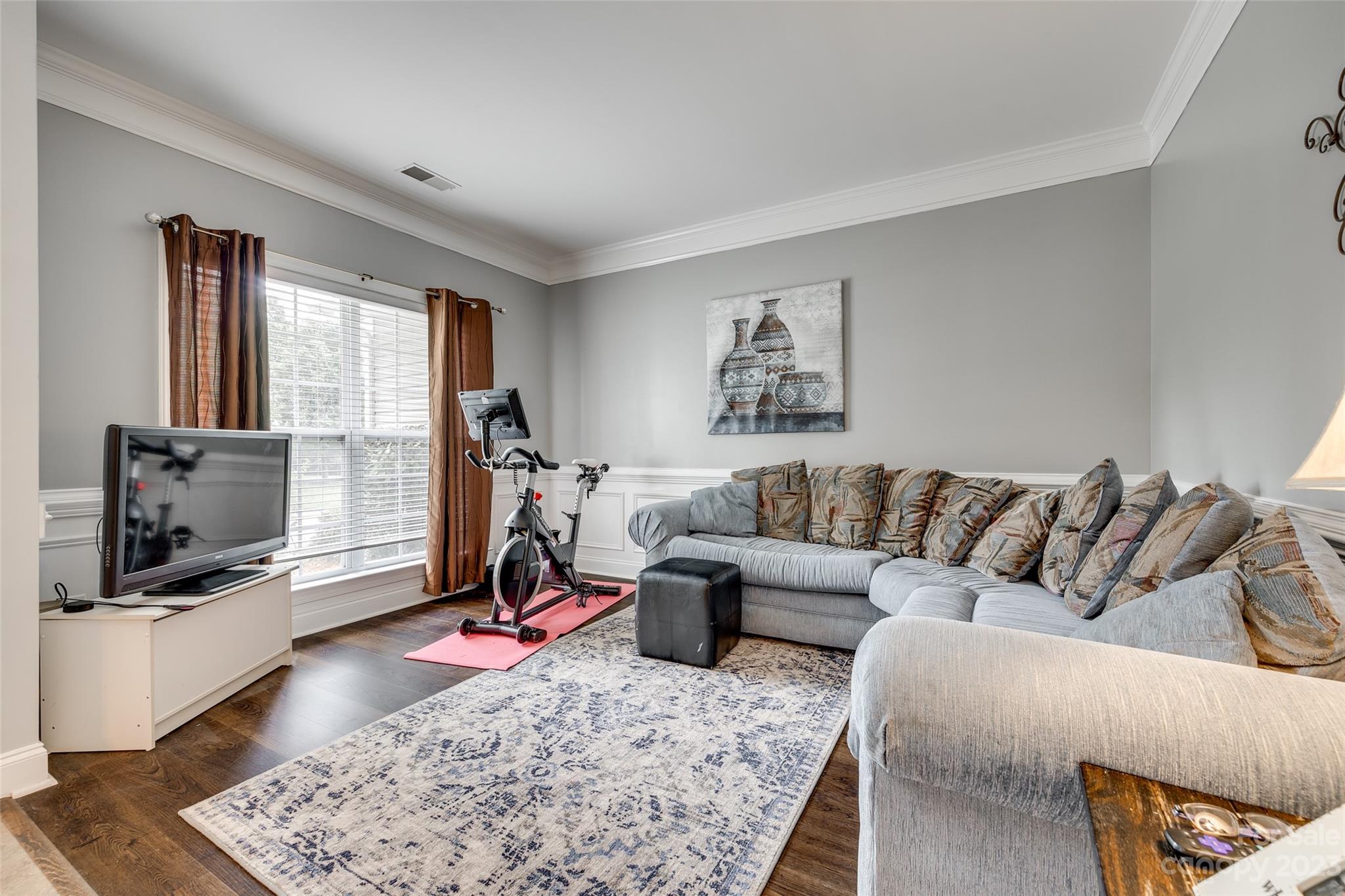 5540 Alexandrite Way Fort Mill, SC 29708 - Photo 6 of 46 a living room with furniture and a flat screen tv