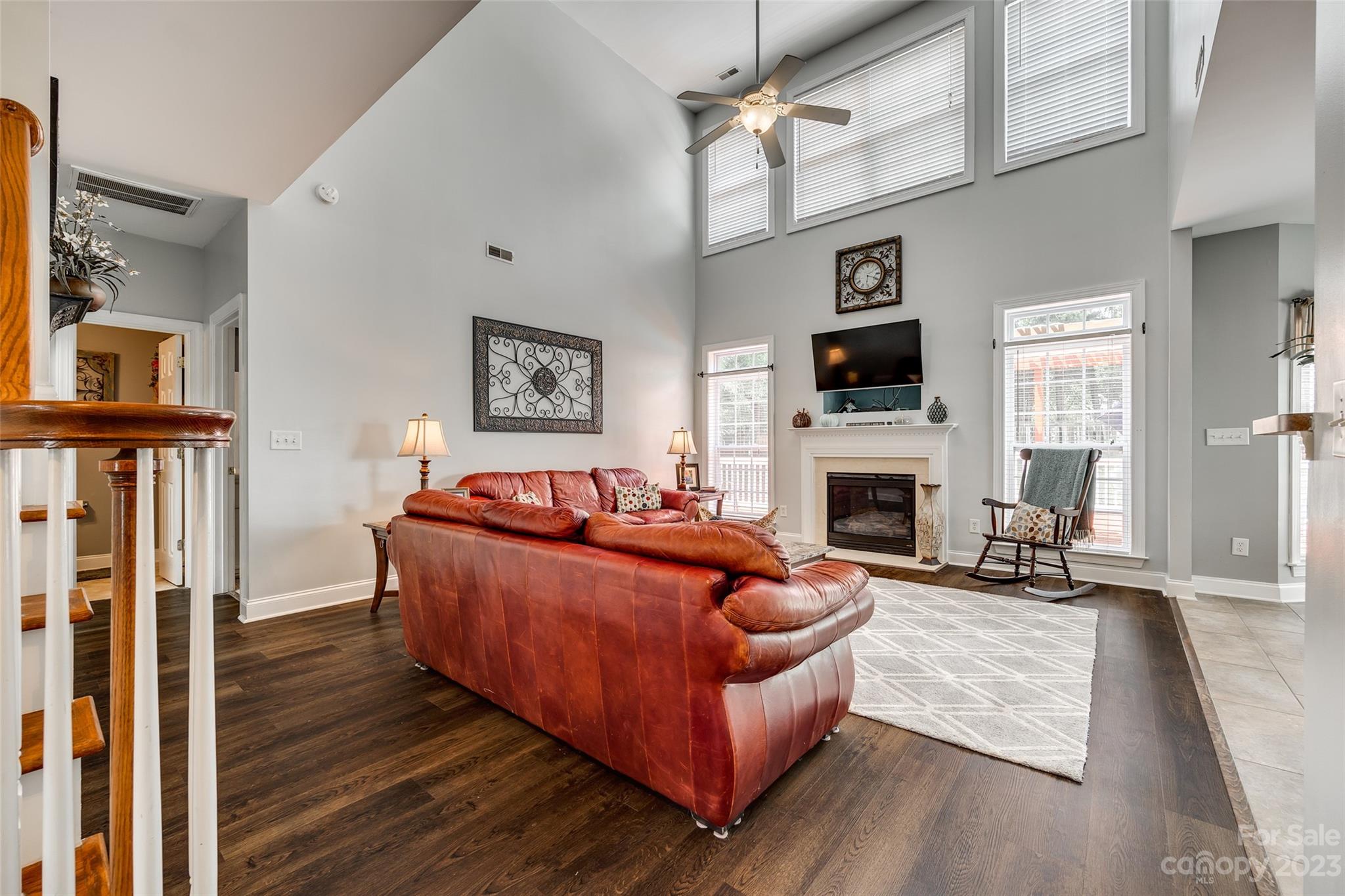 5540 Alexandrite Way Fort Mill, SC 29708 - Photo 9 of 46 a living room with furniture a fireplace and a flat screen tv