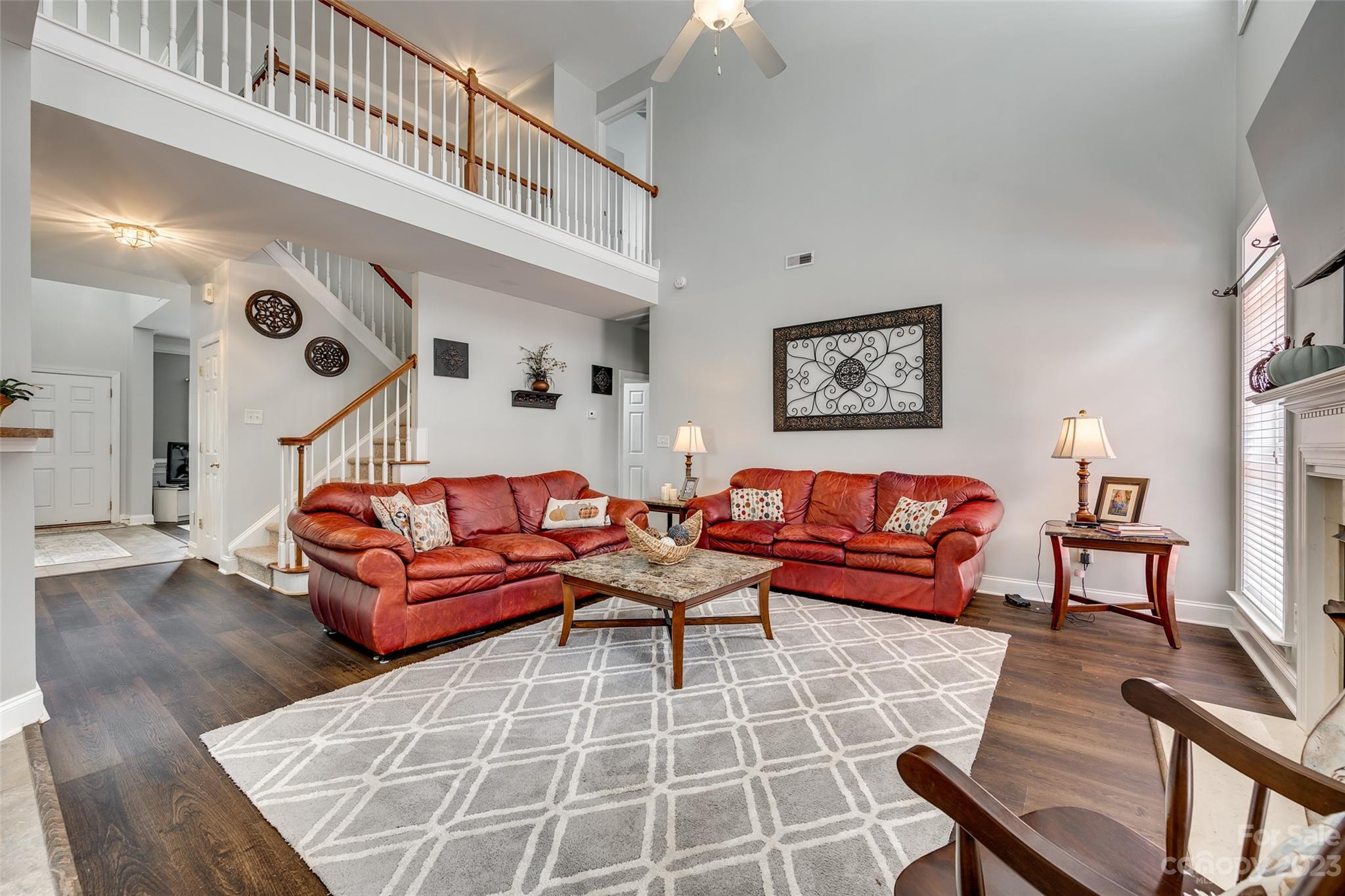 5540 Alexandrite Way Fort Mill, SC 29708 - Photo 10 of 46 a living room with furniture a rug and a wall painting