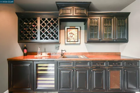 a kitchen with stainless steel appliances a stove and a microwave