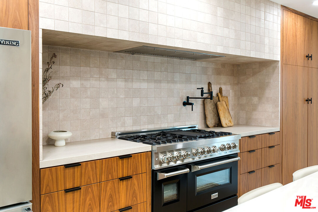 1700 Old Grove Road Pasadena, CA 91107 - Photo 16 of 33 a kitchen with a stove and a wooden cabinets