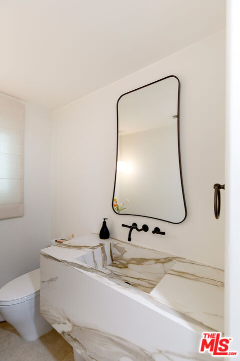 1700 Old Grove Road Pasadena, CA 91107 - Photo 18 of 33 a bathroom with a sink and mirror