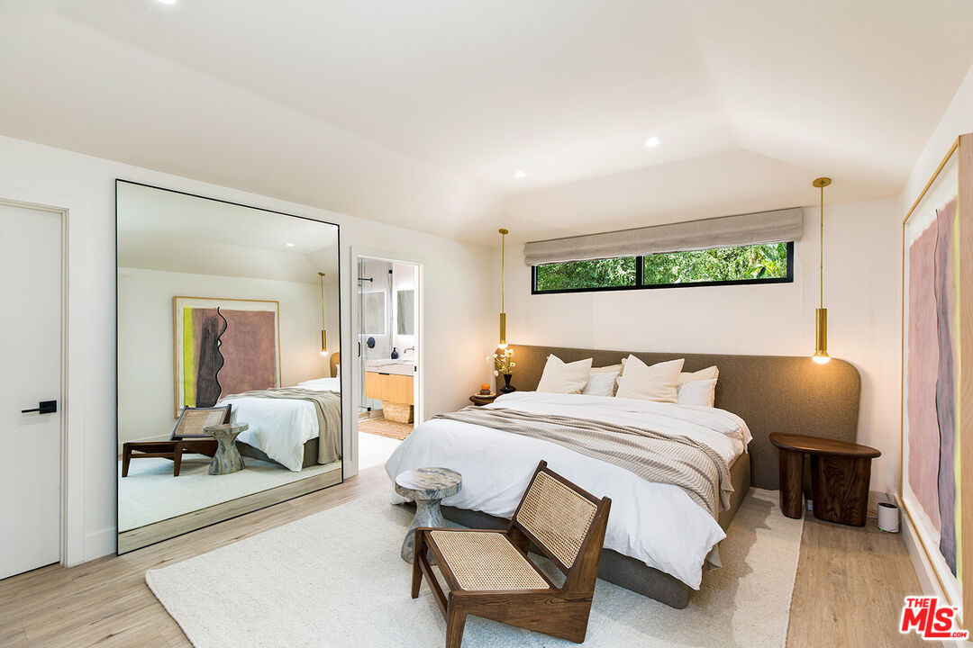 1700 Old Grove Road Pasadena, CA 91107 - Photo 21 of 33 a bedroom with a bed and wooden floor