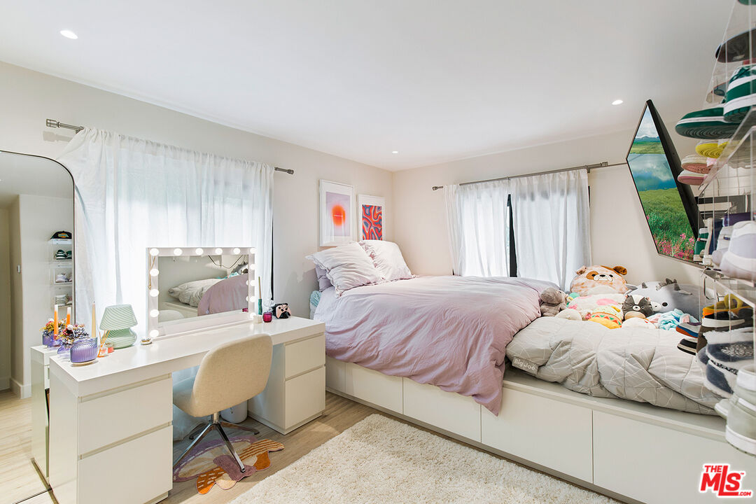 1700 Old Grove Road Pasadena, CA 91107 - Photo 30 of 33 a bedroom with a bed and a mirror