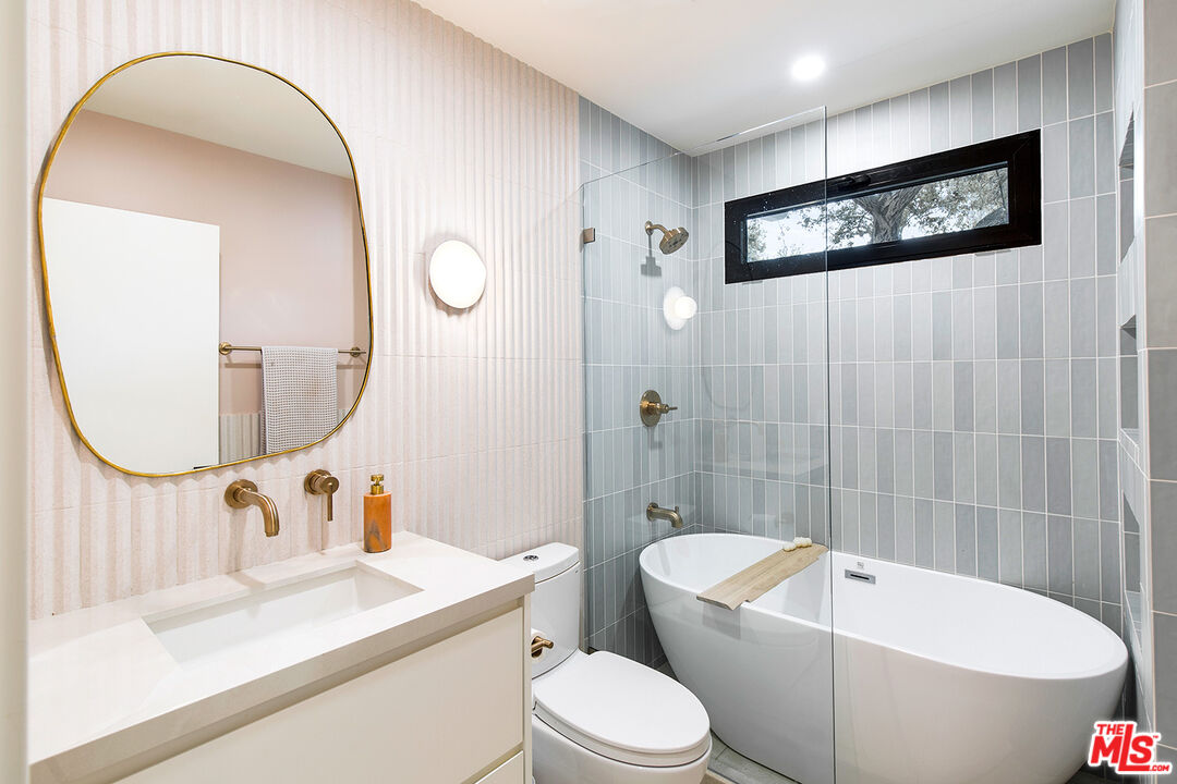 1700 Old Grove Road Pasadena, CA 91107 - Photo 31 of 33 a bathroom with a toilet sink and mirror