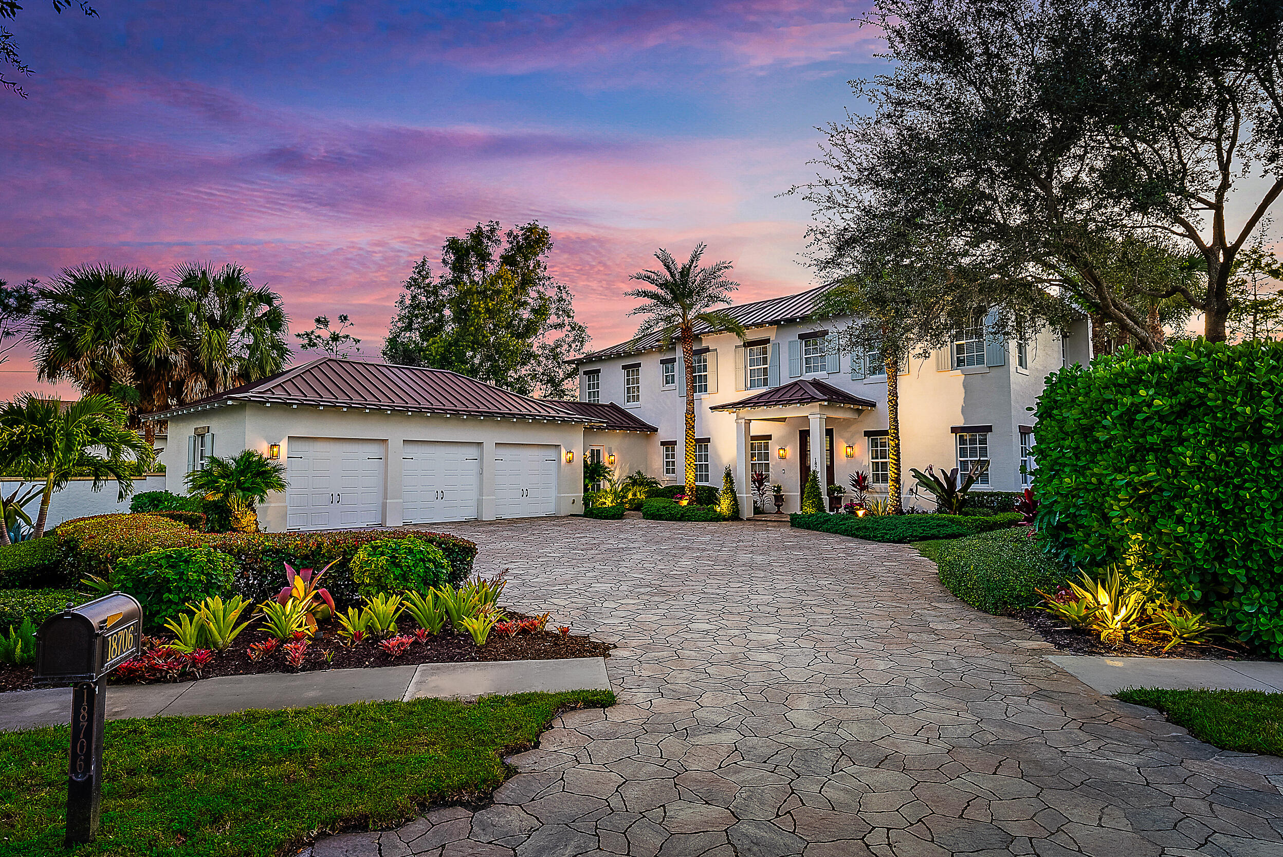 18706 Southeast St Augustine Way Jupiter, FL 33469 - Photo 1 of 74 a front view of a house with a yard