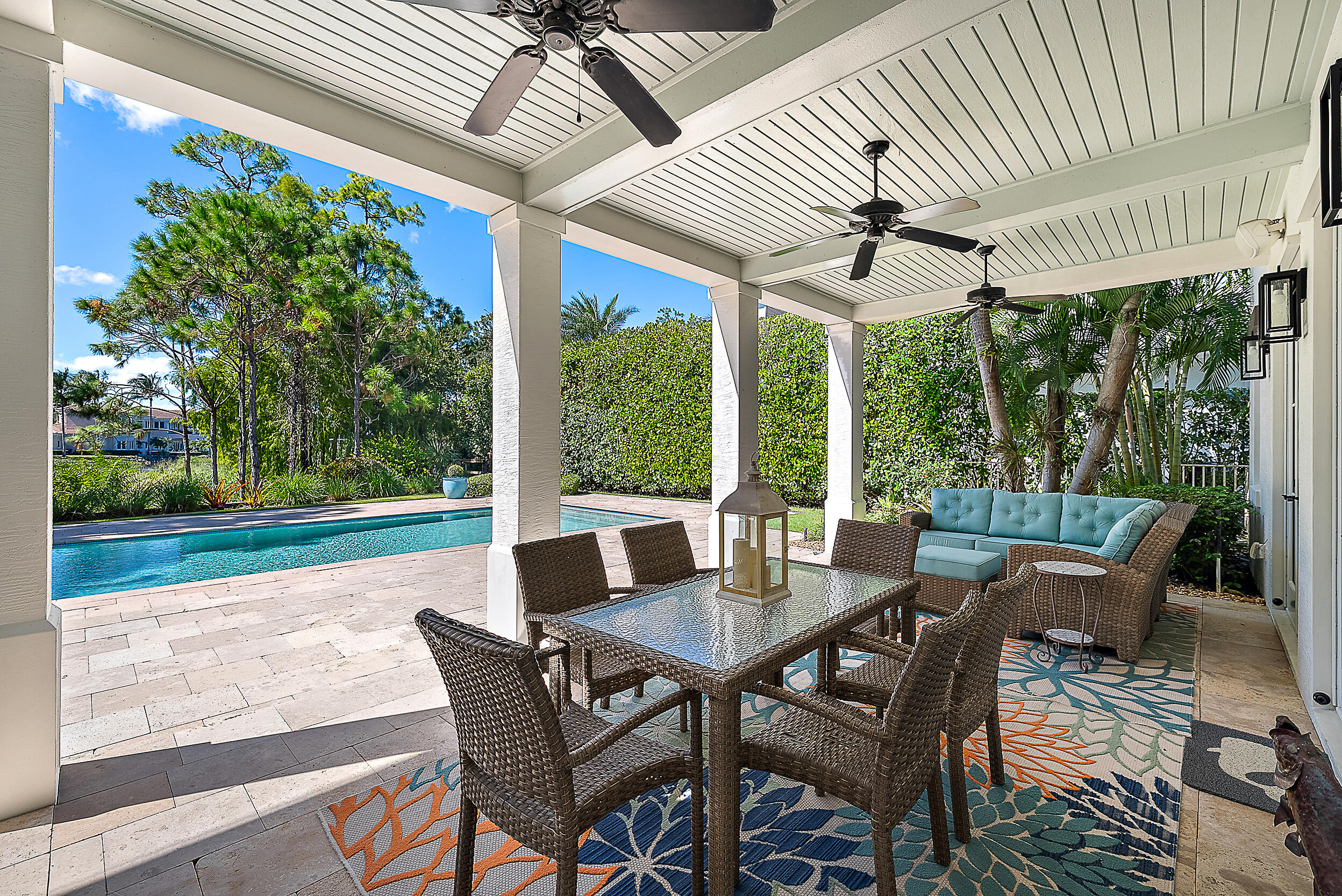 18706 Southeast St Augustine Way Jupiter, FL 33469 - Photo 16 of 74 a view of a patio with a dining table and chairs