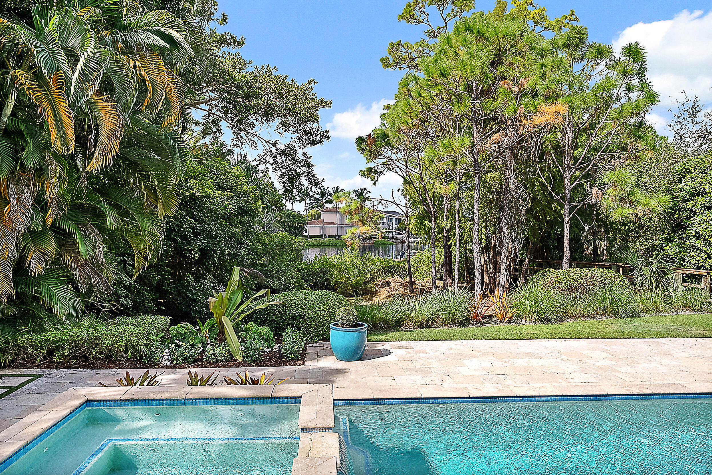 18706 Southeast St Augustine Way Jupiter, FL 33469 - Photo 17 of 74 a view of yard with swimming pool and green space