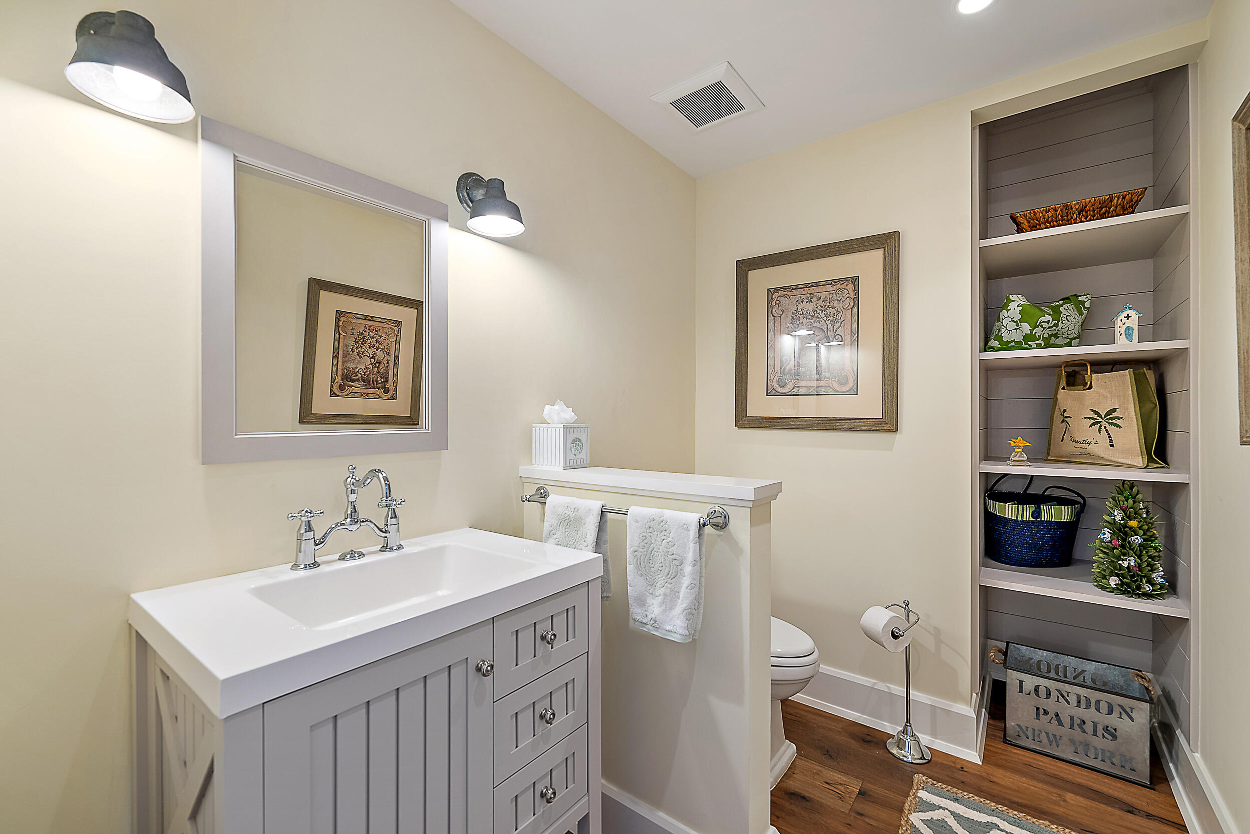18706 Southeast St Augustine Way Jupiter, FL 33469 - Photo 39 of 74 a bathroom with a sink a toilet and a mirror
