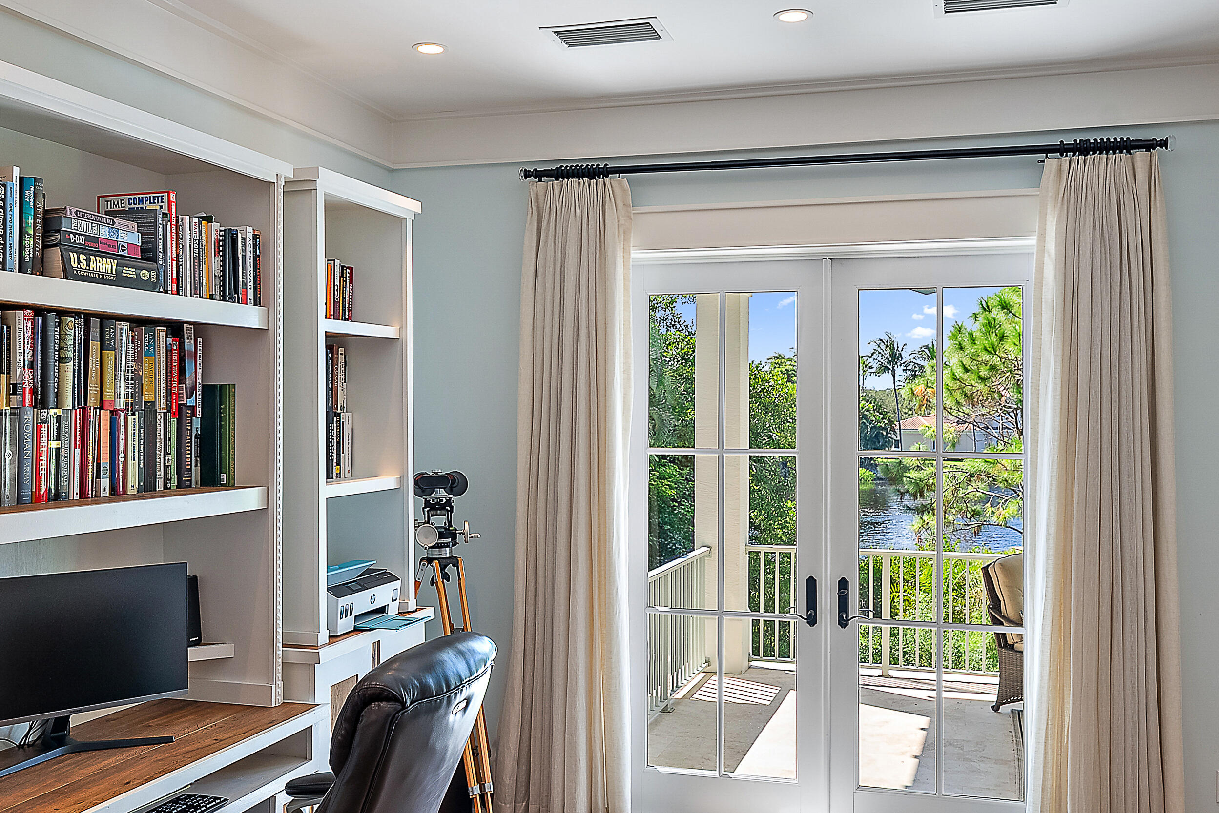 18706 Southeast St Augustine Way Jupiter, FL 33469 - Photo 42 of 74 a view of a workspace with furniture and a window