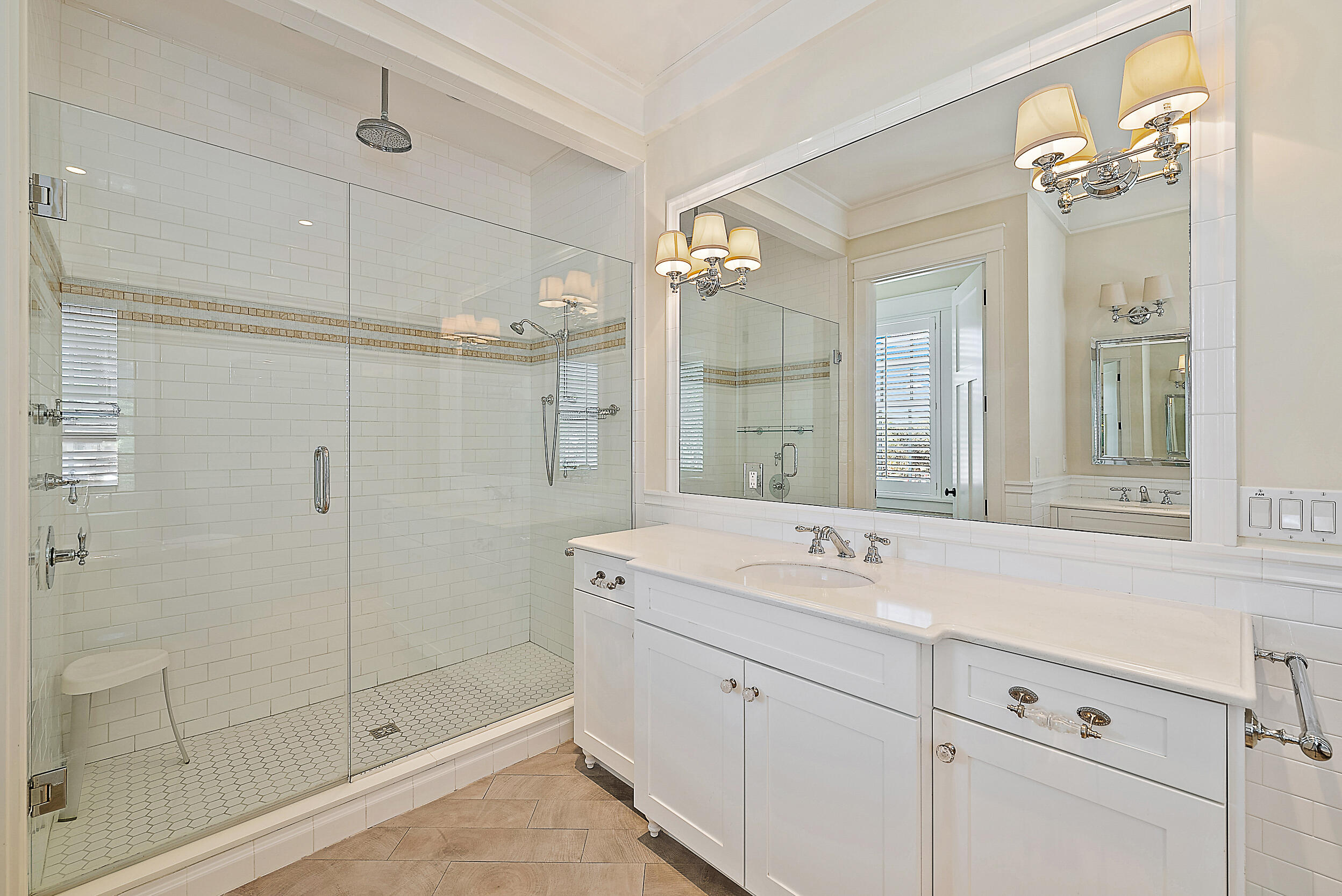 18706 Southeast St Augustine Way Jupiter, FL 33469 - Photo 47 of 74 a bathroom with a shower sink and mirror