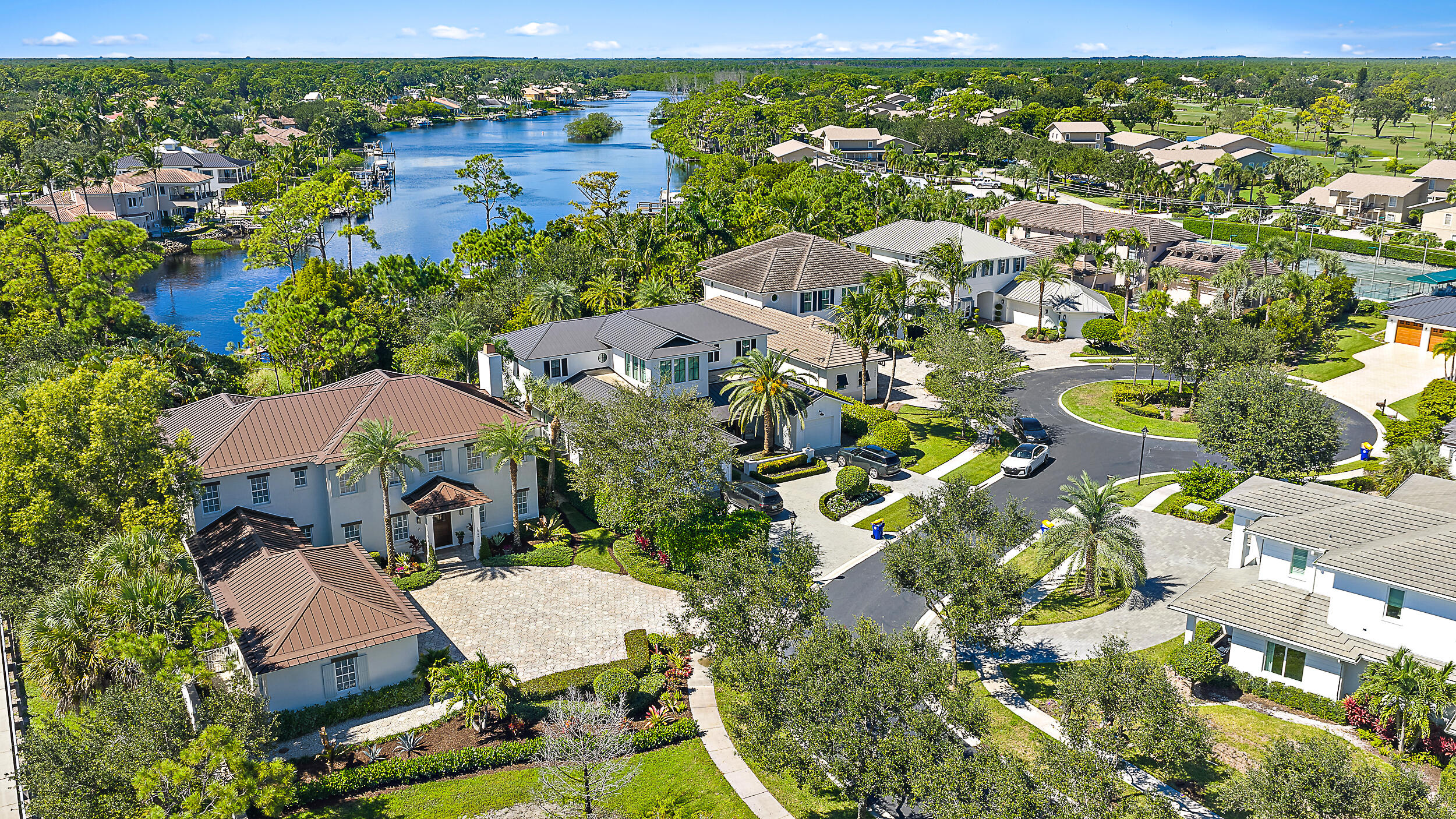 18706 Southeast St Augustine Way Jupiter, FL 33469 - Photo 5 of 74 an aerial view of residential houses with outdoor space and trees