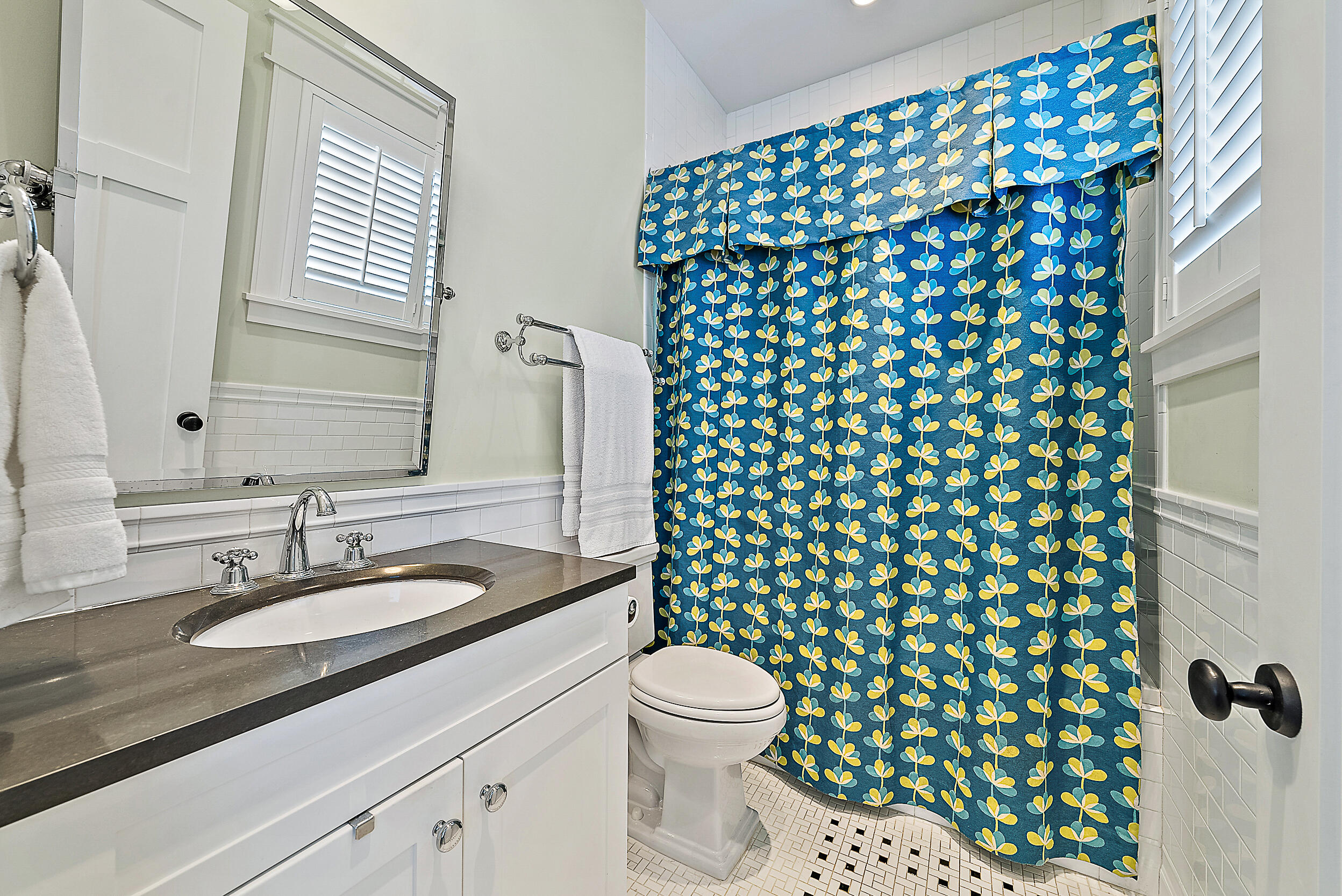 18706 Southeast St Augustine Way Jupiter, FL 33469 - Photo 51 of 74 a bathroom with a granite countertop sink toilet and mirror
