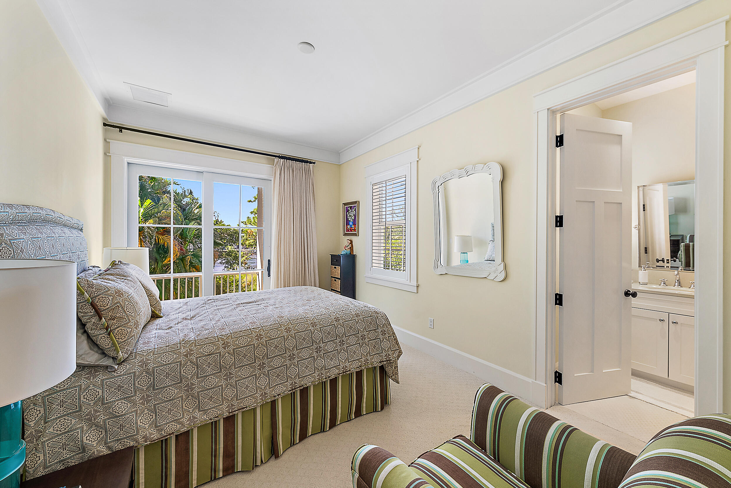 18706 Southeast St Augustine Way Jupiter, FL 33469 - Photo 52 of 74 a bedroom with a bed couch and a window