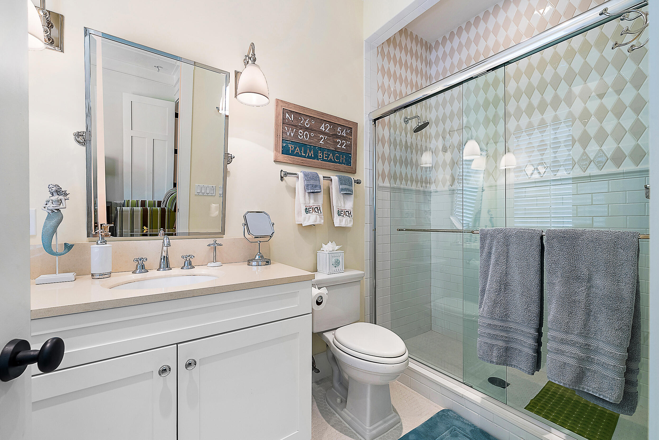 18706 Southeast St Augustine Way Jupiter, FL 33469 - Photo 54 of 74 a bathroom with a sink a toilet and shower