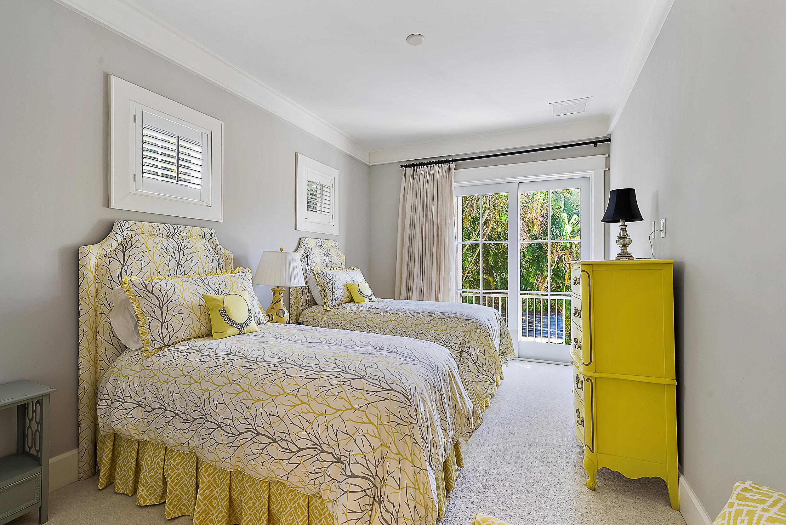 18706 Southeast St Augustine Way Jupiter, FL 33469 - Photo 55 of 74 a bed sitting in a bedroom next to a window