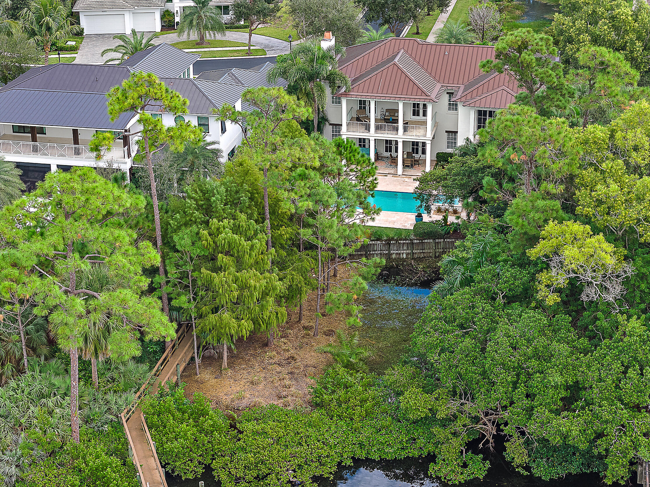 18706 Southeast St Augustine Way Jupiter, FL 33469 - Photo 62 of 74 an aerial view of house with yard and outdoor seating