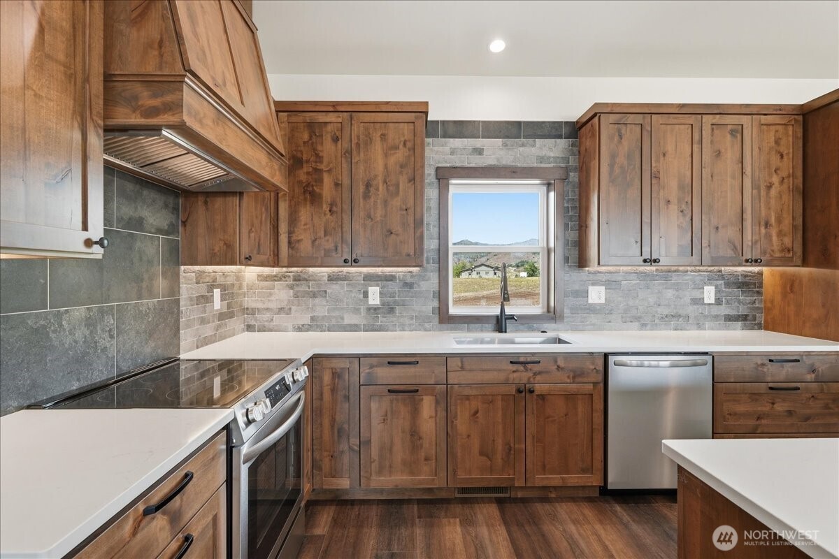 110 Slide View Lane Manson, WA 98831 - Photo 14 of 38 a kitchen with a sink and cabinets