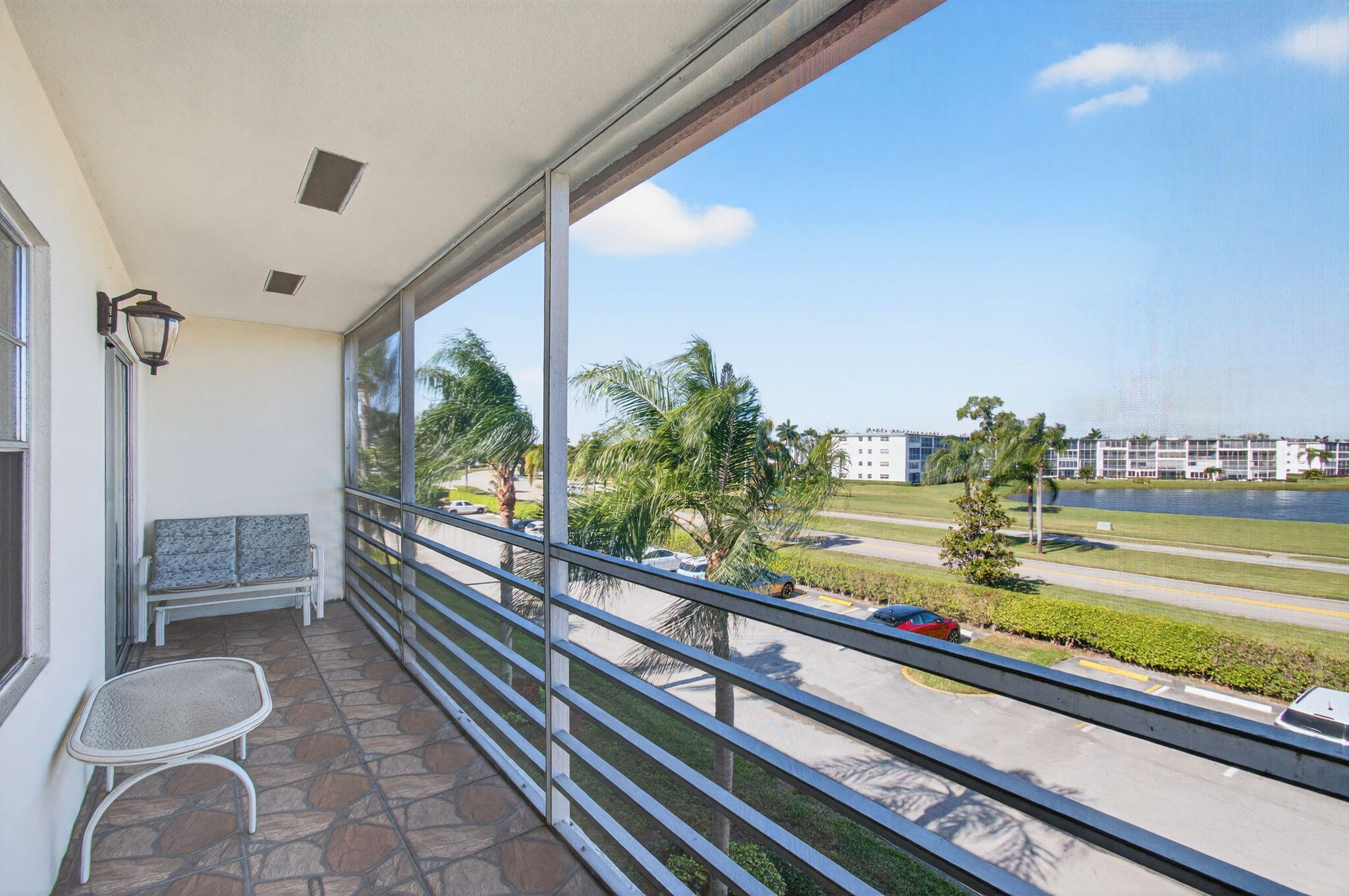 33 Fanshaw A, Unit A Boca Raton, FL 33434 - Photo 46 of 108 17 ft long Screened-In Balcony