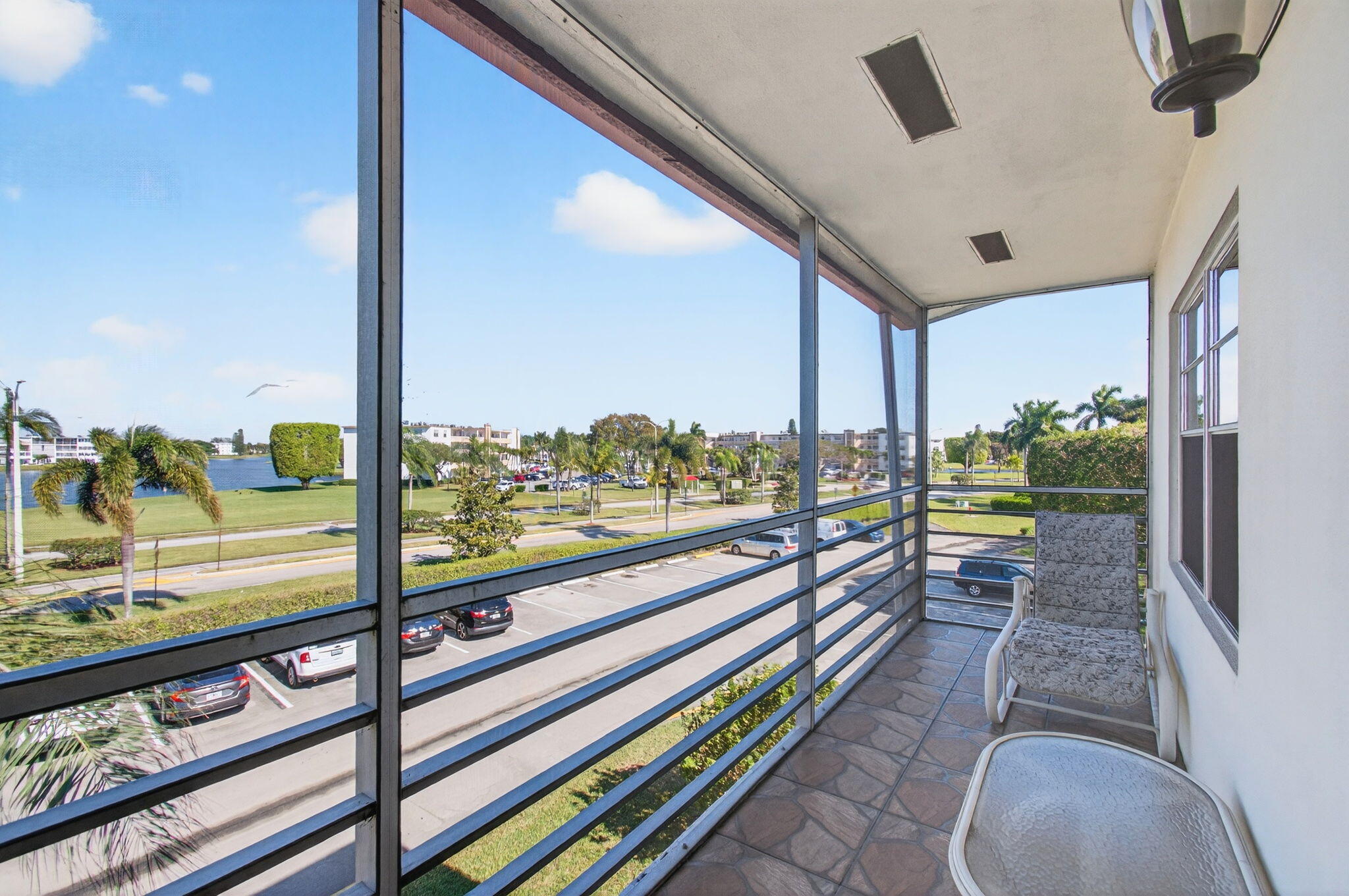 33 Fanshaw A, Unit A Boca Raton, FL 33434 - Photo 50 of 108 17 ft long Screened-In Balcony