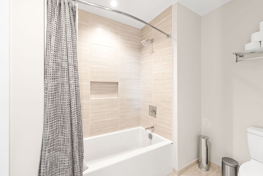40 Traveler Street, Unit 303 Boston, MA 02118 - Photo 12 of 42 a bathroom with a bathtub and shower
