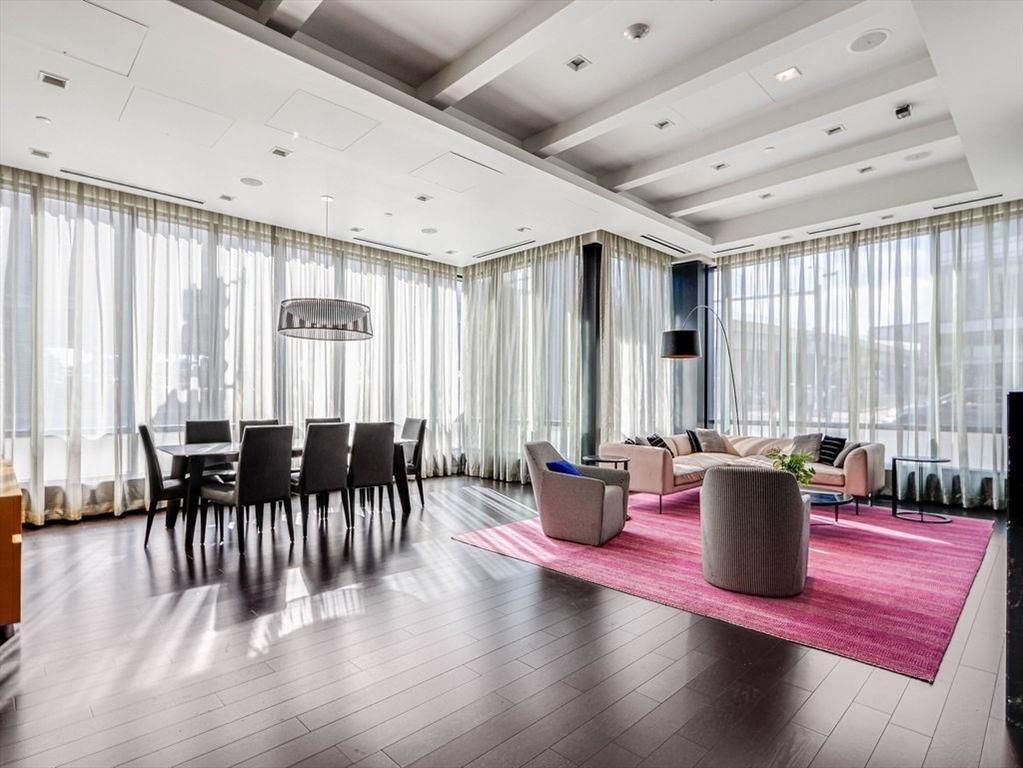 40 Traveler Street, Unit 303 Boston, MA 02118 - Photo 28 of 42 a dining room with wooden floor and furniture
