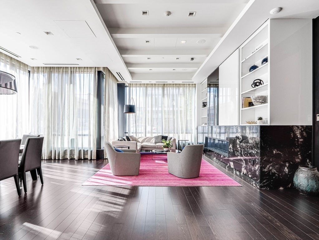 40 Traveler Street, Unit 303 Boston, MA 02118 - Photo 29 of 42 a view of a dining room with furniture and wooden floor