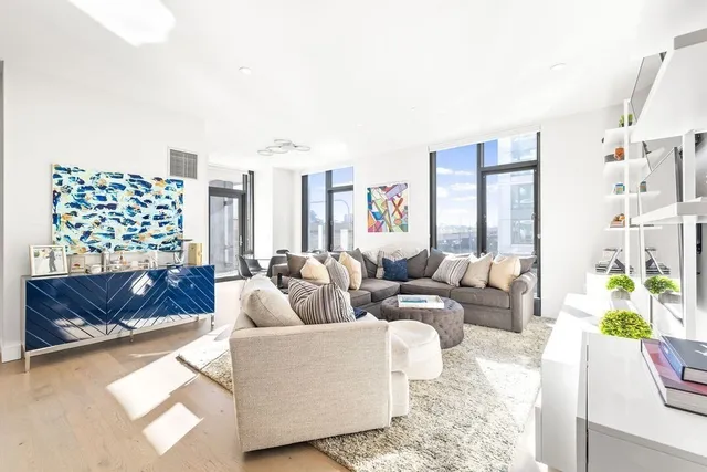 a living room with furniture and a couch